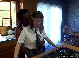 Alluring cowgirl in glasses getting facial cumshot in interracial sex